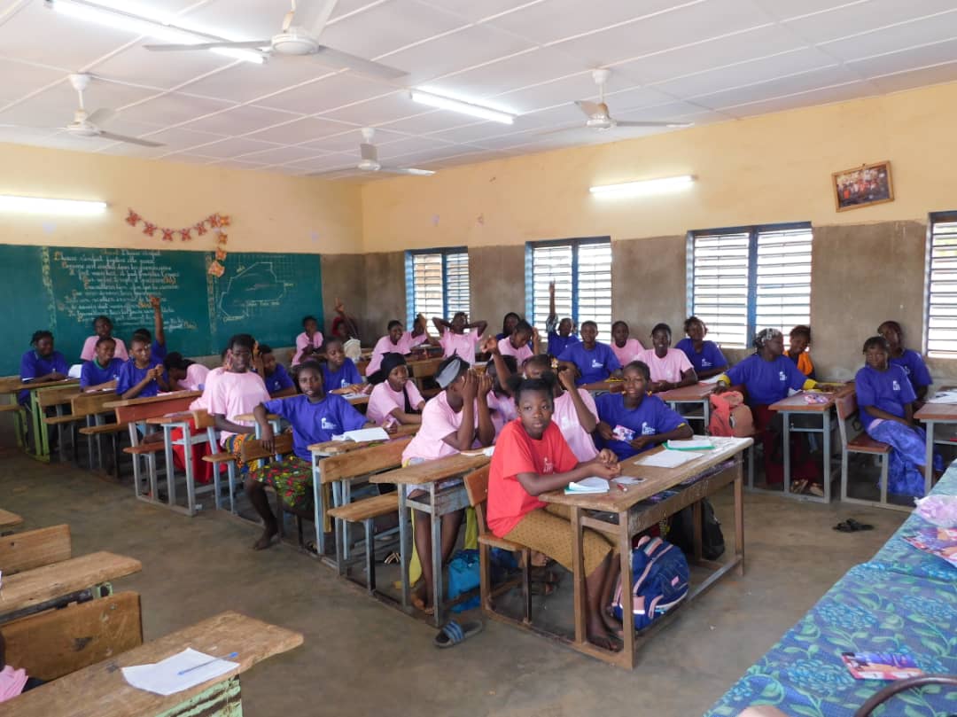 Girls listening to a lesson at our menstrual education workshop in school in Burkina Faso, West Africa.