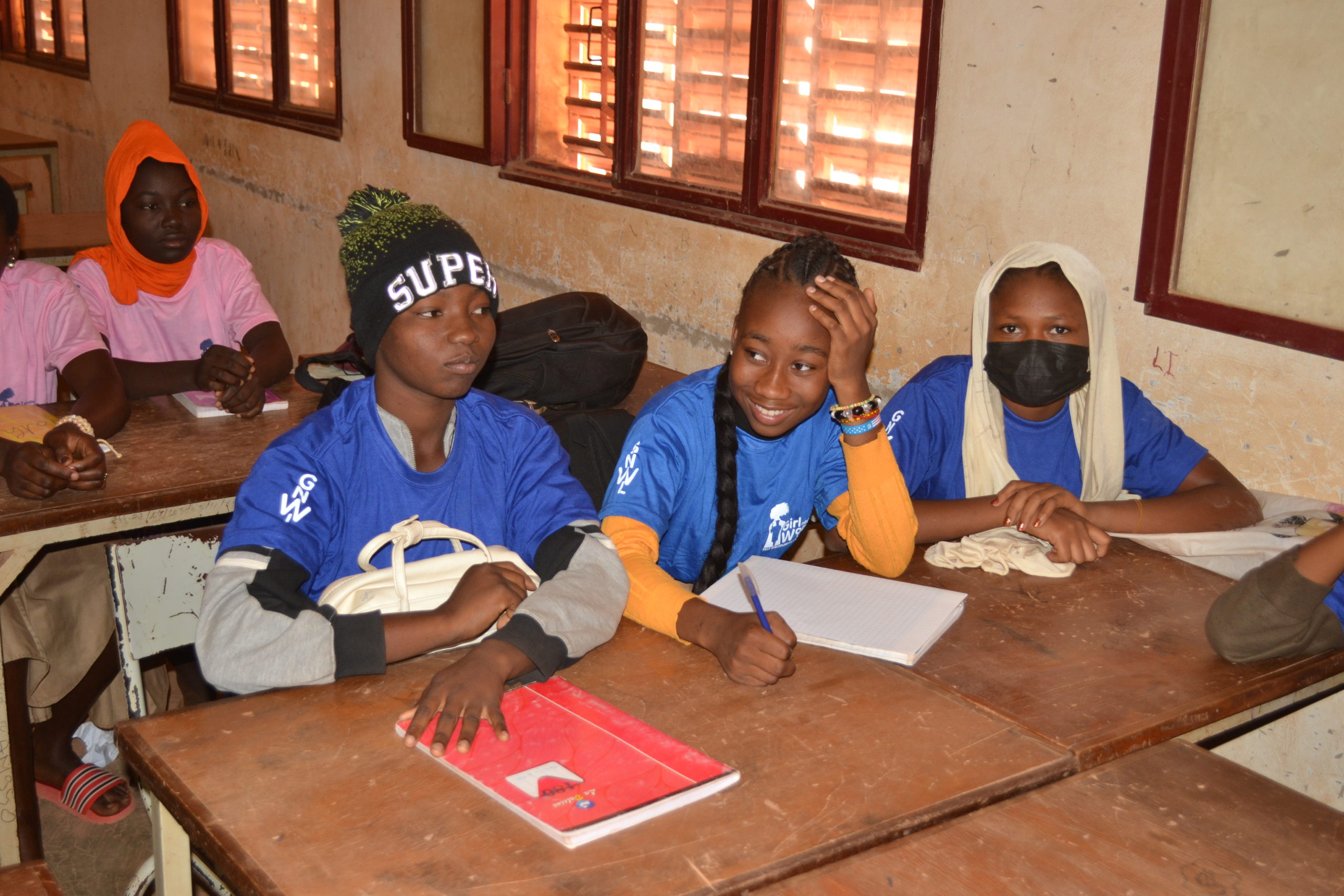 Girls listening to a lesson at our menstrual education workshop in school in Burkina Faso, West Africa.