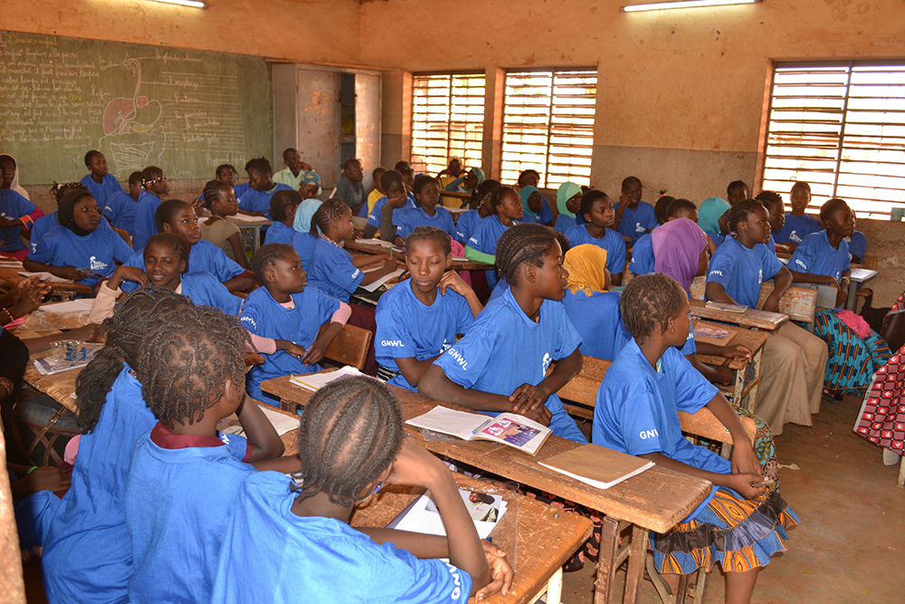 Girls listening to a lesson at our menstrual education workshop in Nord-C school in Burkina Faso, West Africa.