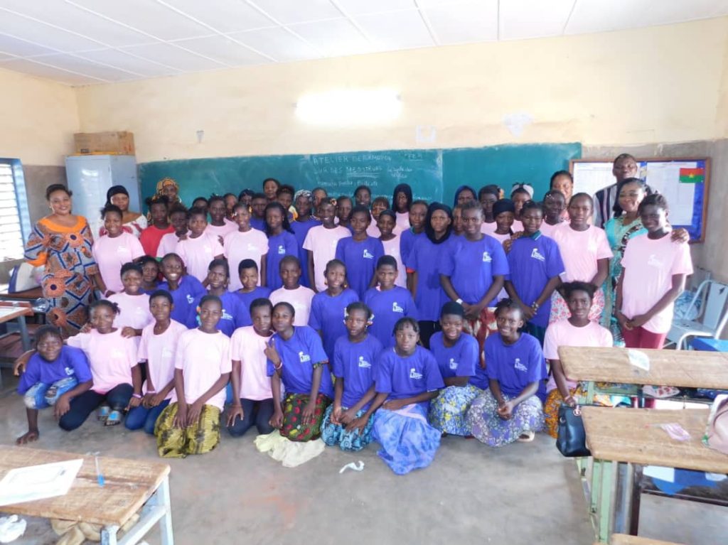 Group picture of girls at our period education workshop in Burkina Faso, West Africa.