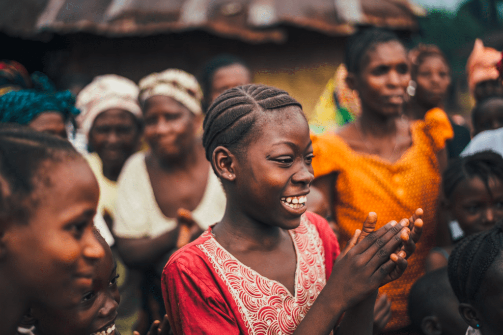 Girl clapping her hands in celebration, smiling